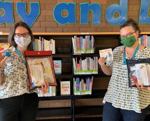 Library Staff displaying October Storytime Kits