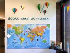Display wall at library with world map.
