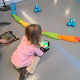 Girl playing with robots