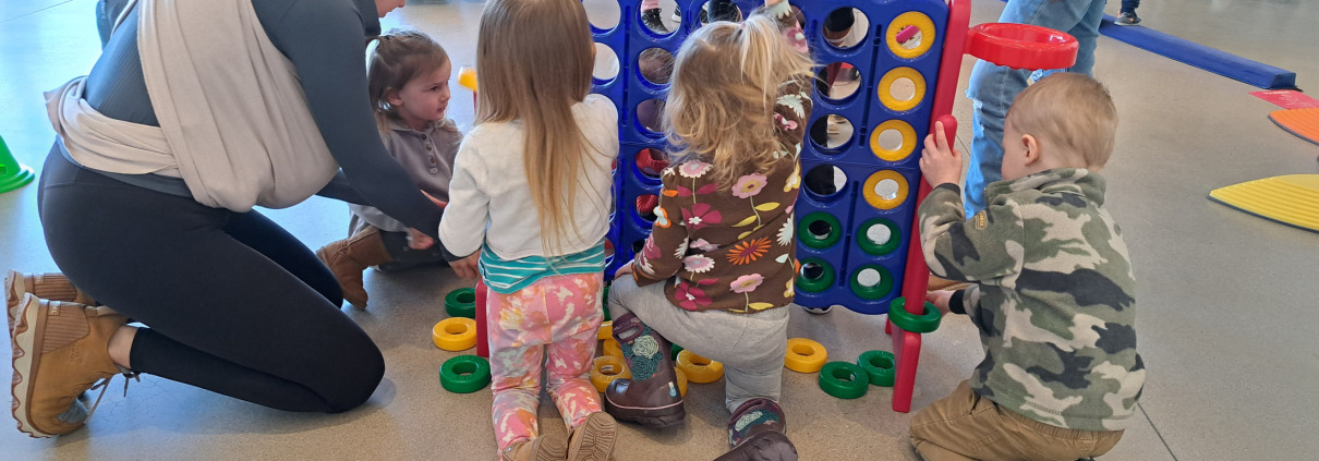 Children playing Connect Four.