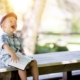 Boy with book, laughing