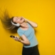 Woman wearing headphones listening to music