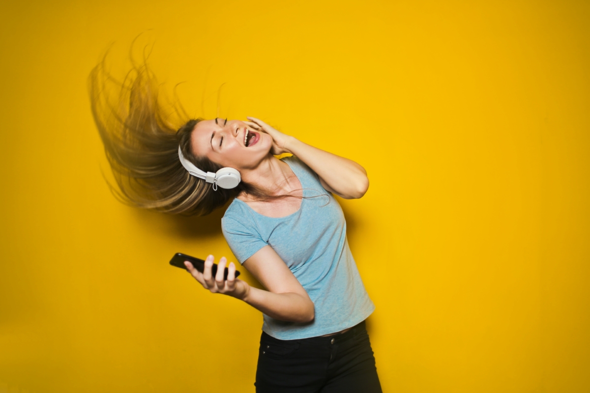 Woman wearing headphones listening to music