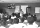 Rosa Parks at the front of a classroom speaking to students