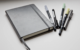 Photograph of a Bullet Journal with various writing instruments