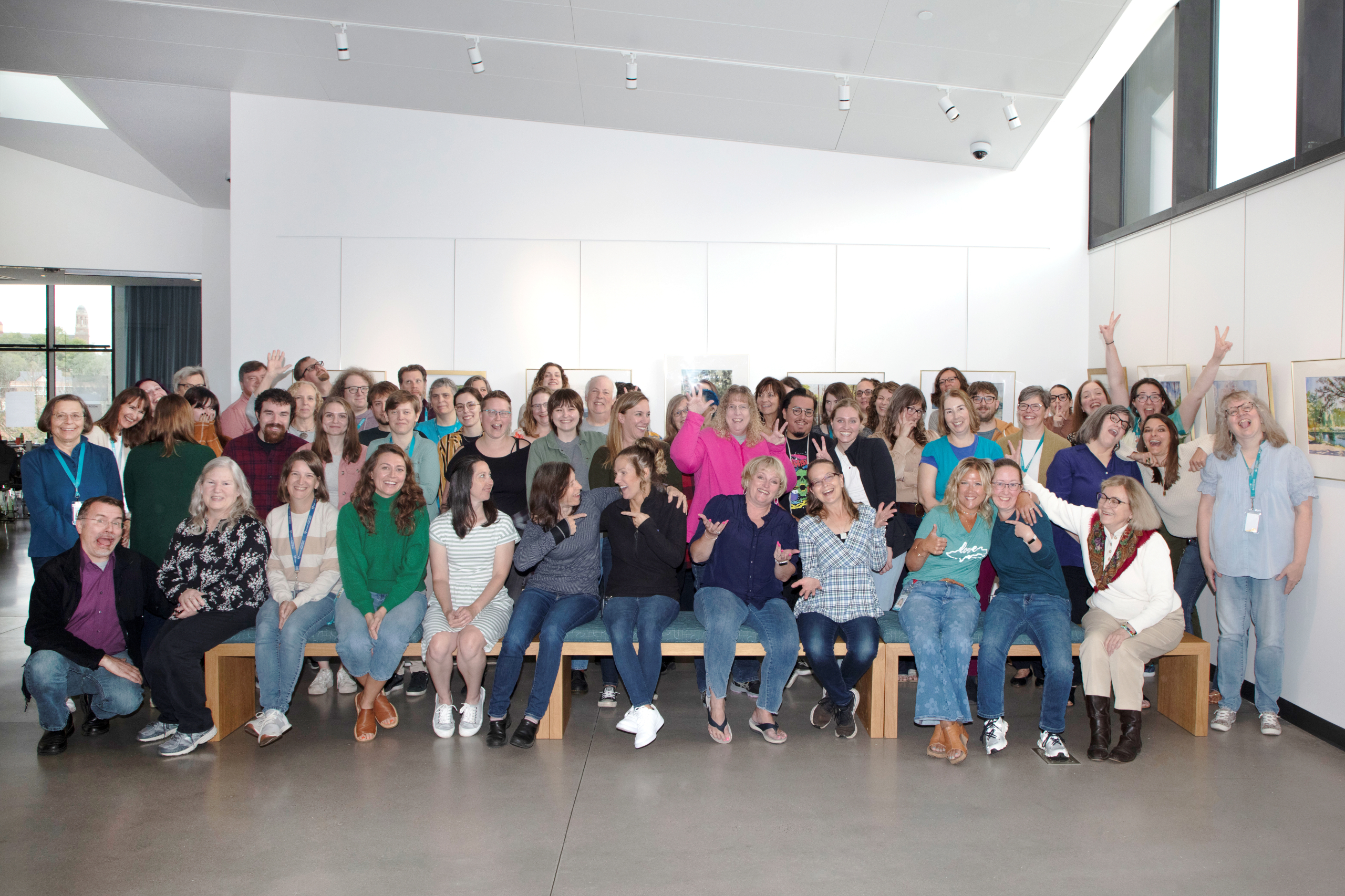 Photo shows library staff making silly faces and poses